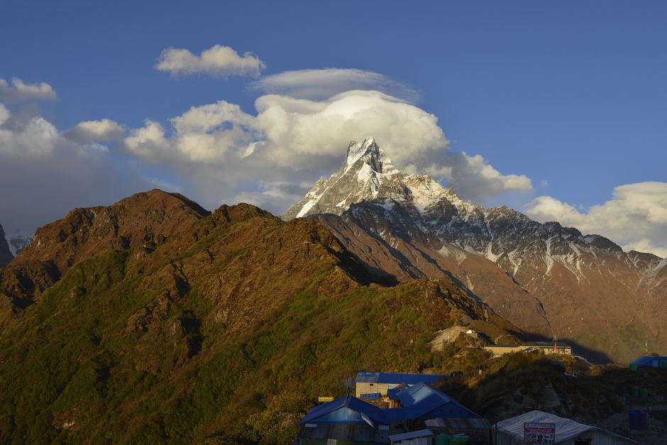 Stunning landscape of Machapuchare peak in Nepal's Himalayas at sunset.