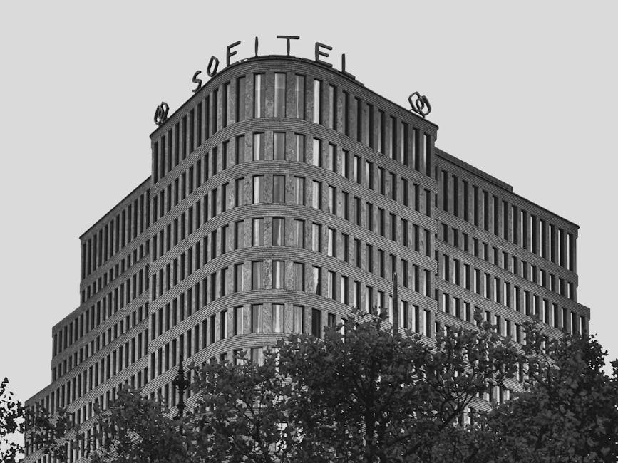 Black and white photo of Sofitel Hotel's modern facade in Berlin, Germany.
