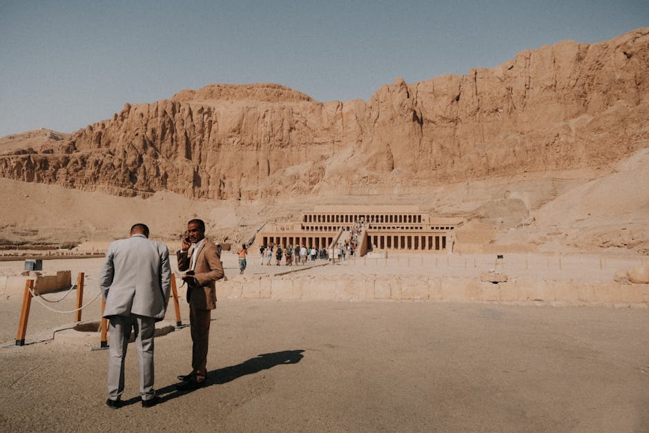 Tourists visit the Mortuary Temple of Hatshepsut in Luxor, Egypt, a renowned ancient landmark.
