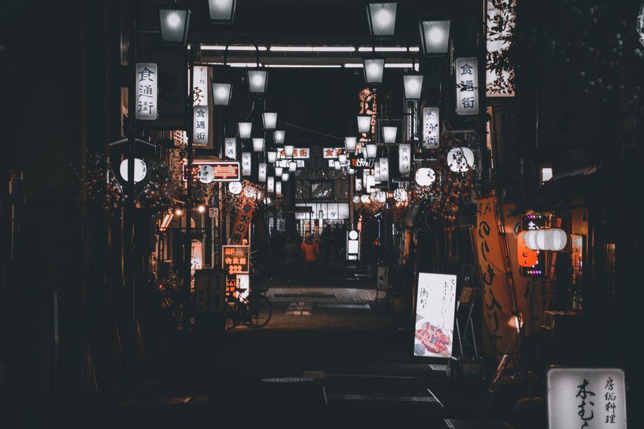 A picturesque night street in Japan, adorned with traditional lanterns creating a serene atmosphere.