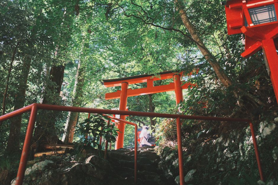 Explore the lush greenery and iconic red torii gates at Kyoto's Kifune Shrine. Perfect for travel enthusiasts.