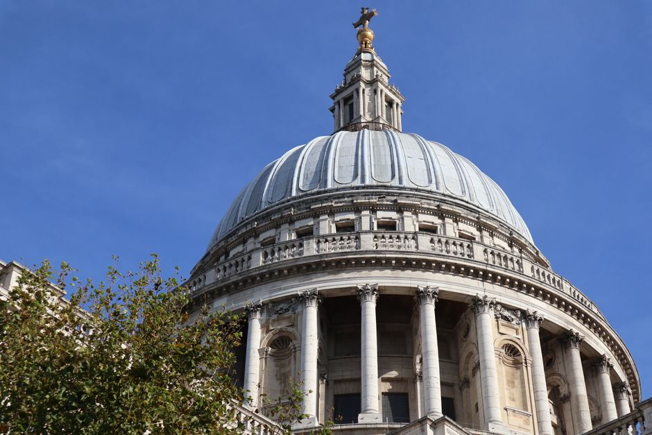 Magnificent view of the iconic dome of St. Paul's Cathedral set against a clear blue sky i